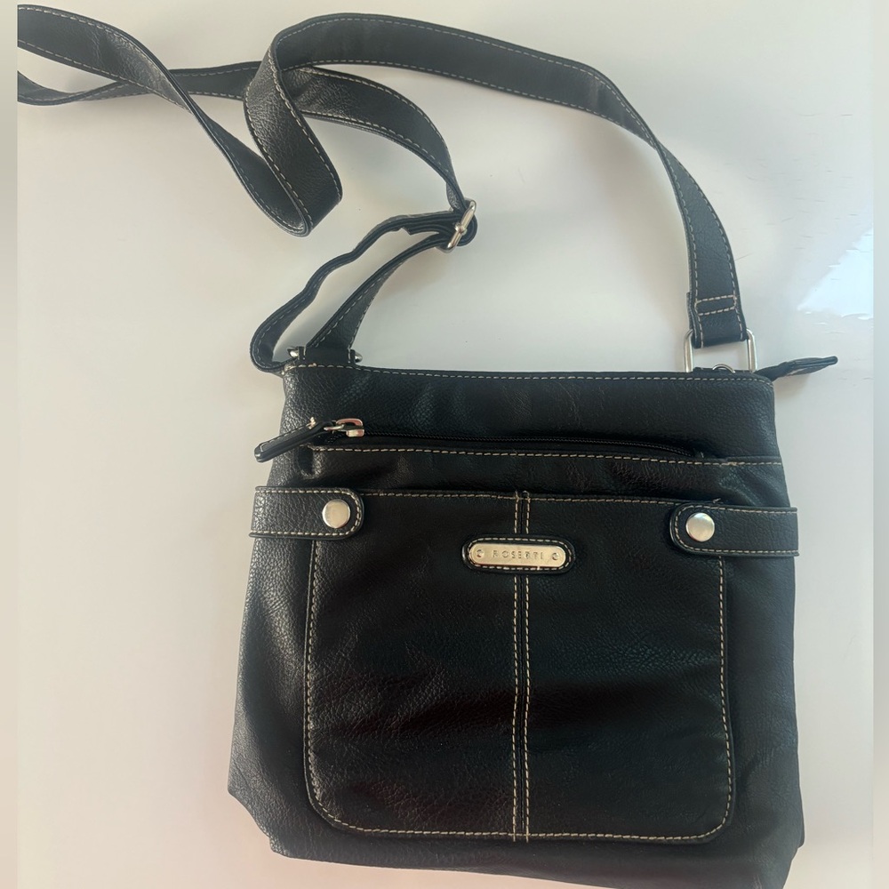 Rosetti Black faux leather crossbody bag.